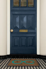 Monkey See Monkey Do Turquoise Doormat by Iris Apfel